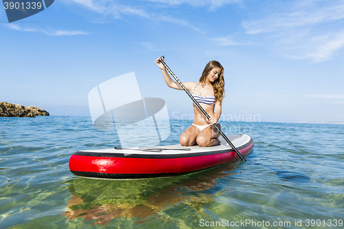 Image of Woman practicing paddle