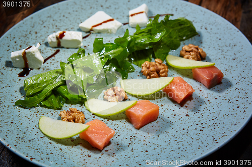 Image of Homemade salad with apple and salmon