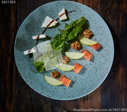 Image of Homemade salad with apple and salmon