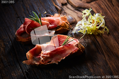 Image of Two slice of Spanish tapas with jamon