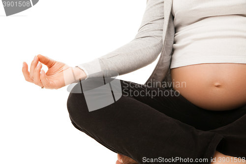 Image of Pregnant woman relax doing yoga over white