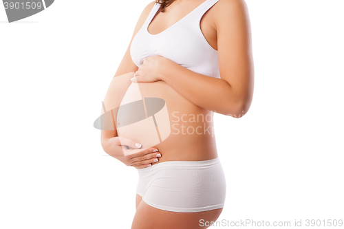 Image of Beautiful belly of young attractive pregnant woman