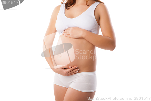 Image of Beautiful belly of young attractive pregnant woman