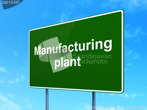 Image of Industry concept: Manufacturing Plant on road sign background