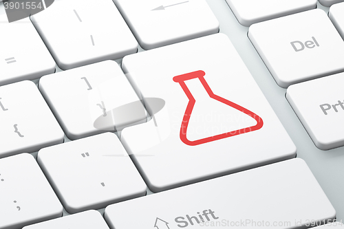 Image of Science concept: Flask on computer keyboard background