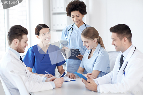 Image of group of happy doctors meeting at hospital office