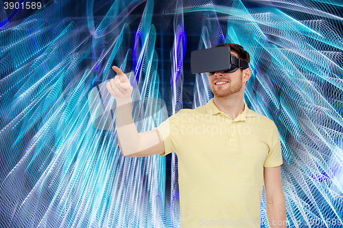 Image of happy man in virtual reality headset or 3d glasses