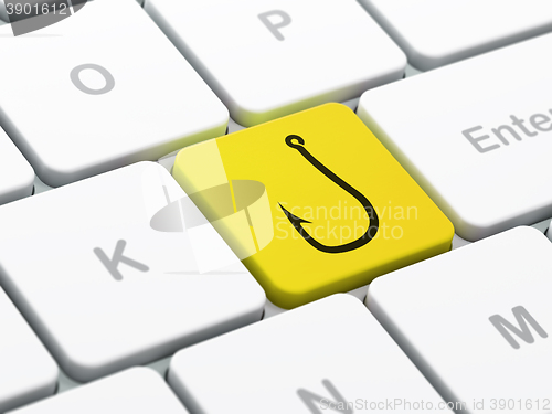 Image of Safety concept: Fishing Hook on computer keyboard background