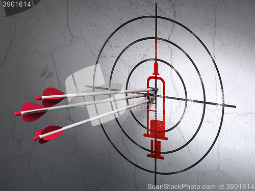 Image of Medicine concept: arrows in Syringe target on wall background