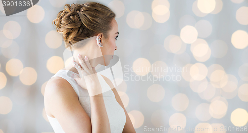 Image of close up of beautiful woman with ring and earring