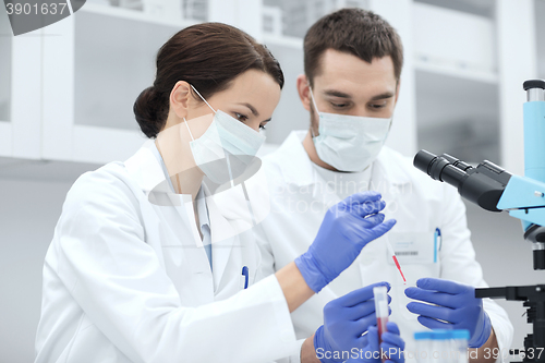 Image of young scientists making test or research in lab