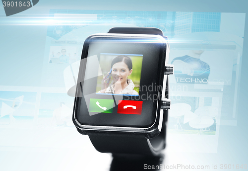 Image of close up of black smart watch with video call icon