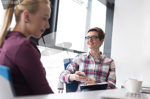 Image of young business woman at modern office meeting room