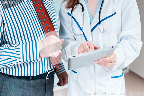 Image of Close-up of doctor and patient hands