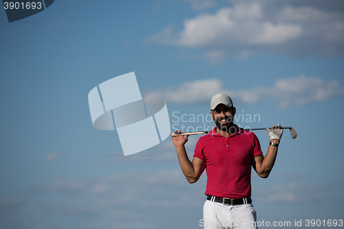 Image of handsome middle eastern golf player portrait at course