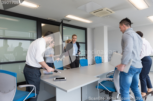 Image of business people group entering meeting room, motion blur