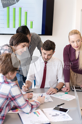 Image of young business people group on meeting at modern office