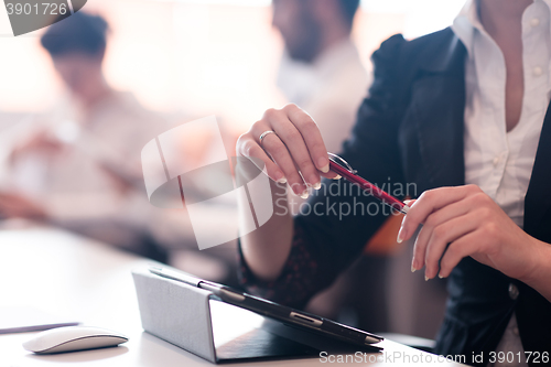 Image of woman hands holding pen on business meeting