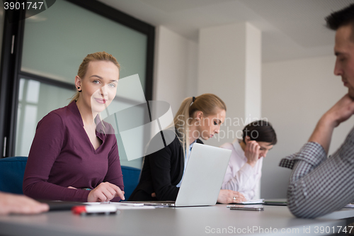 Image of young business people group on team meeting at modern office