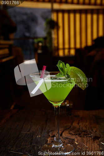 Image of Martini glass with green cocktail