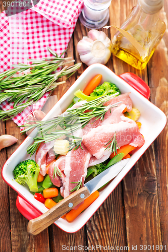 Image of raw meat with vegetables