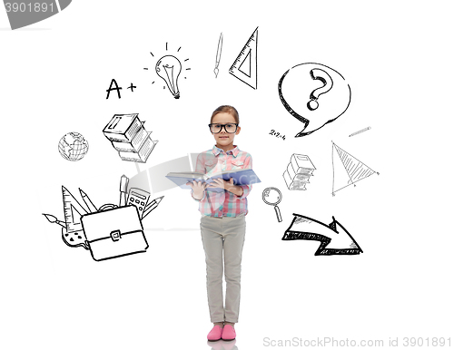 Image of happy little girl in eyeglasses reading book