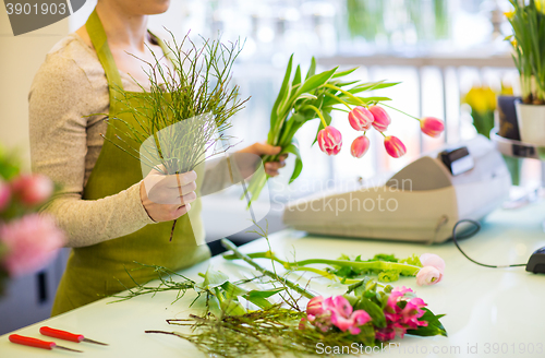 Image of close up of florist making bunch at flower shop