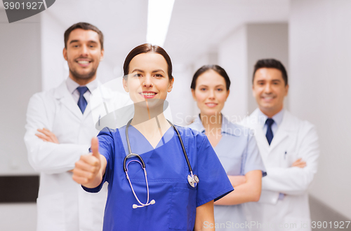 Image of medics or doctors at hospital showing thumbs up