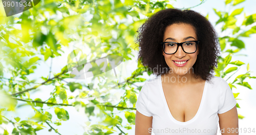 Image of happy african woman or student girl in eyeglasses