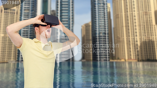 Image of happy man in virtual reality headset or 3d glasses