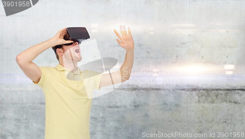 Image of happy man in virtual reality headset or 3d glasses