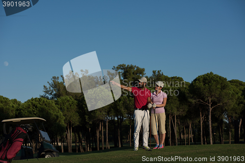 Image of portrait of couple on golf course