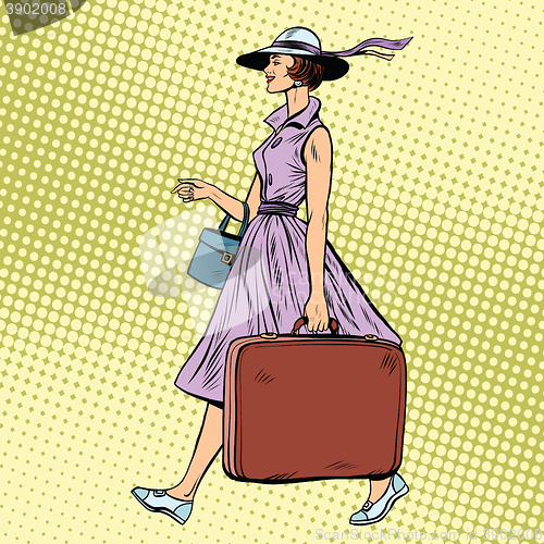 Image of Woman traveler with suitcase