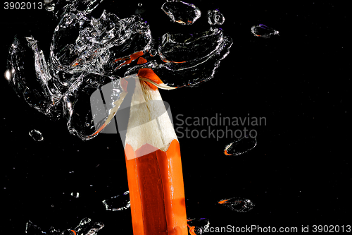 Image of Crayon under water with bubbles of air.