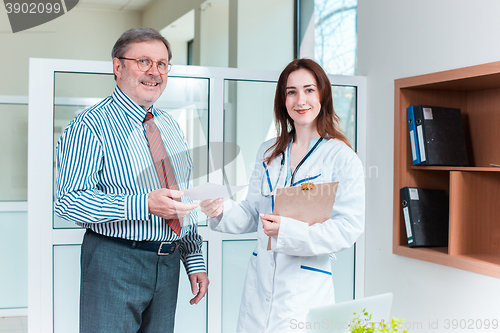 Image of The patient and his doctor in medical office