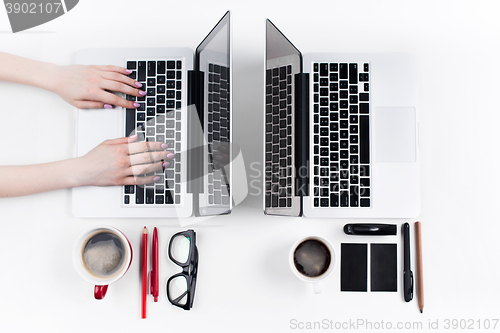 Image of Hands of people working in the office. Technology.