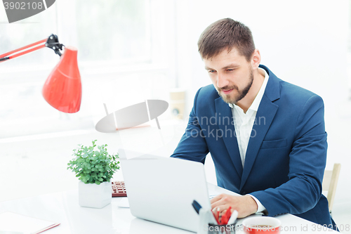 Image of The elegant businessman sitting in  the office