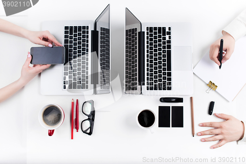 Image of Hands of people working in the office. Technology.