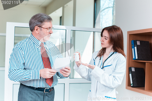 Image of The patient and his doctor in medical office