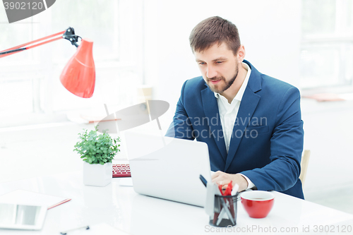 Image of The elegant businessman sitting in  the office