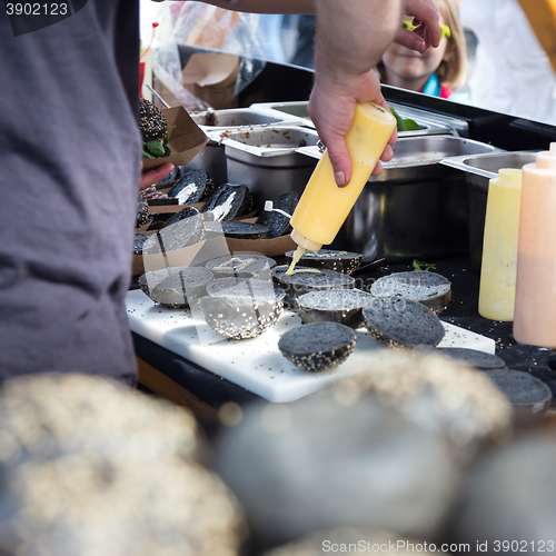 Image of Burgers ready to serve on food stall.