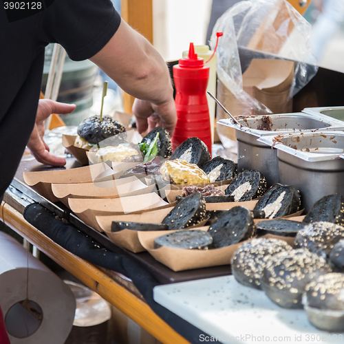 Image of Burgers ready to serve on food stall.