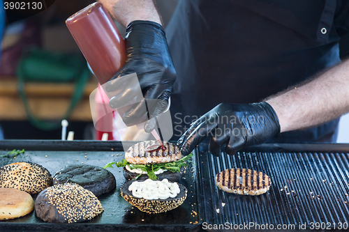 Image of Beef burgers ready to serve on food stall.