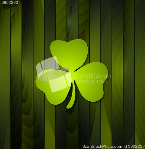 Image of Clovers shamrock on green wooden background