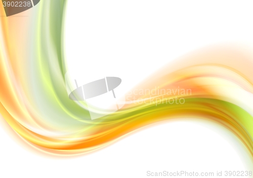 Image of Green and orange smooth blurred waves on white