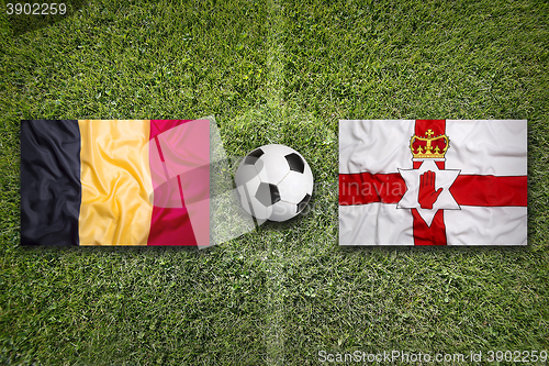 Image of Belgium vs. Northern Ireland flags on soccer field