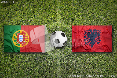 Image of Portugal vs. Albania flags on soccer field