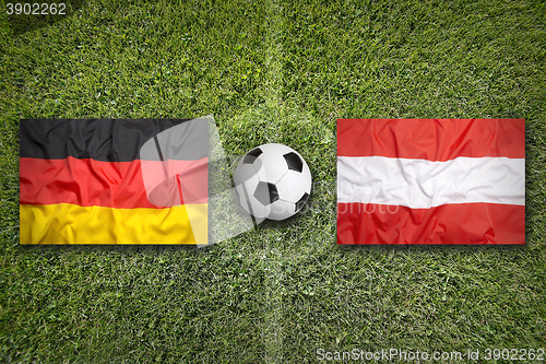 Image of Germany vs. Austria flags on soccer field