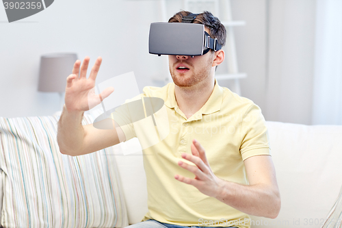 Image of young man in virtual reality headset or 3d glasses