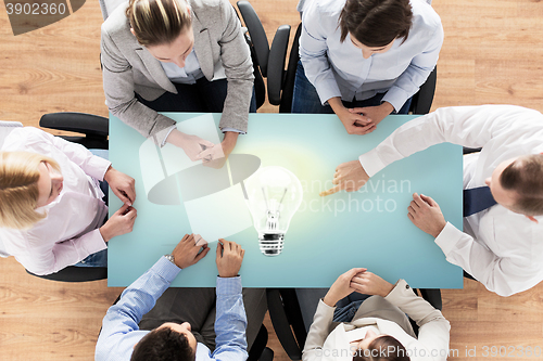 Image of close up of business team sitting at table